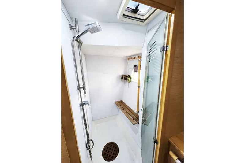Slide: The Image of Interior shower of 2008 Lagoon 500 yacht with modern fixtures and wooden accents. - 53