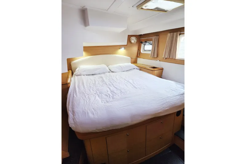 Slide: The Image of Luxurious cabin interior of 2008 Lagoon 500 yacht with cozy bed and natural light. - 55