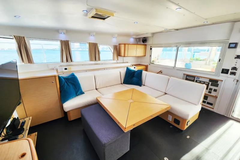 Slide: The Image of Spacious interior of 2008 Lagoon 500 yacht with modern seating and large windows. - 38