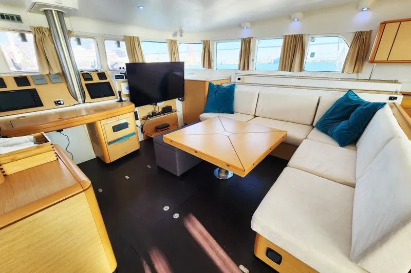 Slide: The Image of Luxurious interior of a 2008 Lagoon 500 yacht with modern furnishings and large windows. - 37