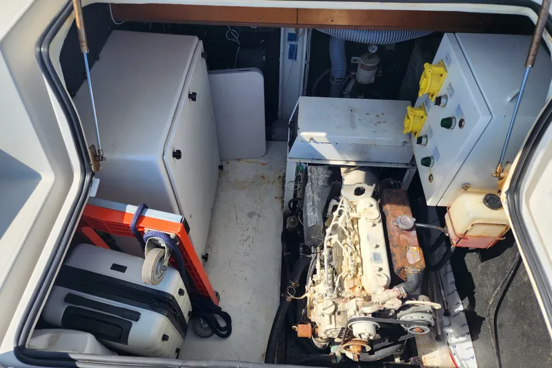 Slide: The Image of 11.5 kW Onan Generator in fwd cockpit locker - 67