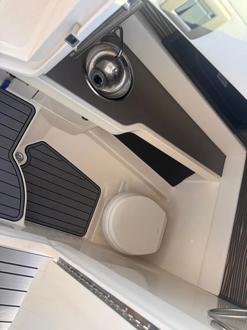 Slide: The Image of Interior of the Sea Ray SLX 310 Outboard with a sink and toilet. - 18