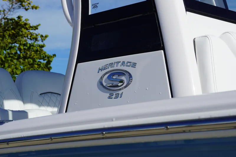 Slide: The Image of 2026 Sportsman Heritage 231 Center Console boat, close-up of logo and seating. - 3