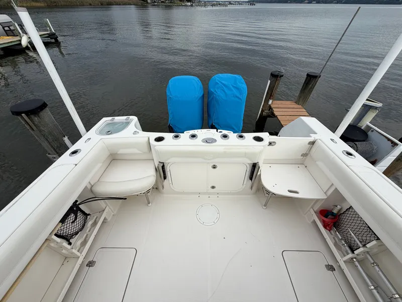 Slide: The Image of The image shows the cockpit of a 2014 Sailfish 290 CC with two engines at the stern. - 17