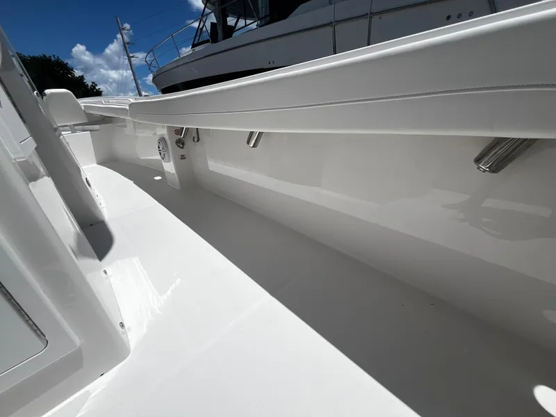 Slide: The Image of 2025 Regulator 23 boat interior, white deck and side railings. - 15