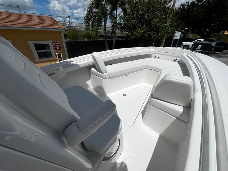 Slide: The Image of 2025 Regulator 23 boat interior with white seating and modern design. - 19