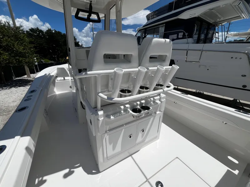 Slide: The Image of 2025 Regulator 23 boat interior with rod holders and storage compartments. - 11