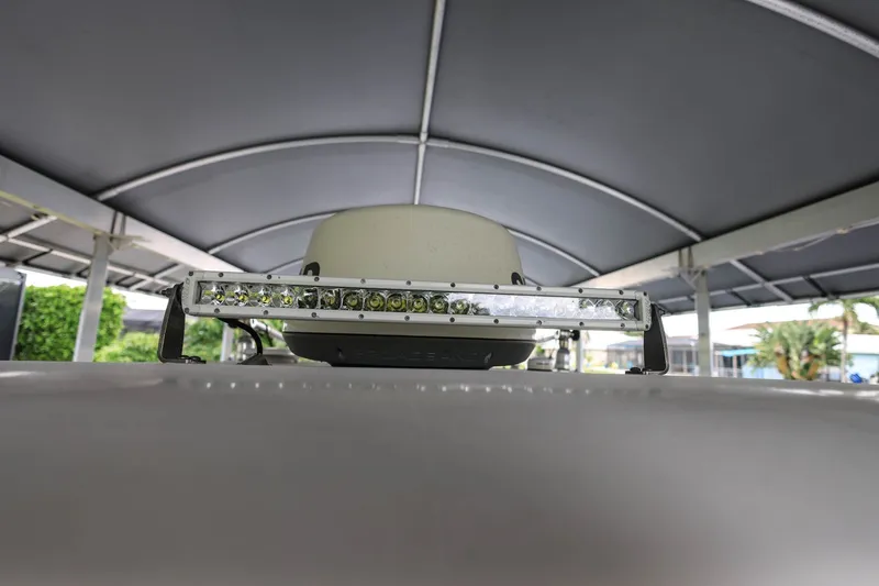 Slide: The Image of 2018 Sportsman Open 282 Center Console with LED light bar under canopy. - 24