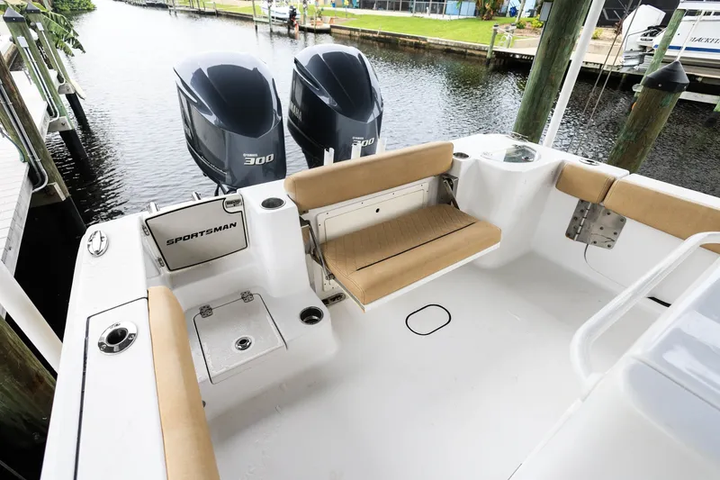 Slide: The Image of 2018 Sportsman Open 282 Center Console boat with twin Yamaha 300 engines docked. - 22
