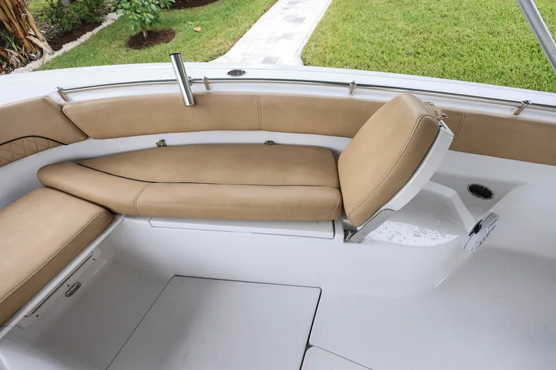 Slide: The Image of 2018 Sportsman Open 282 Center Console boat interior with tan cushioned seating. - 14