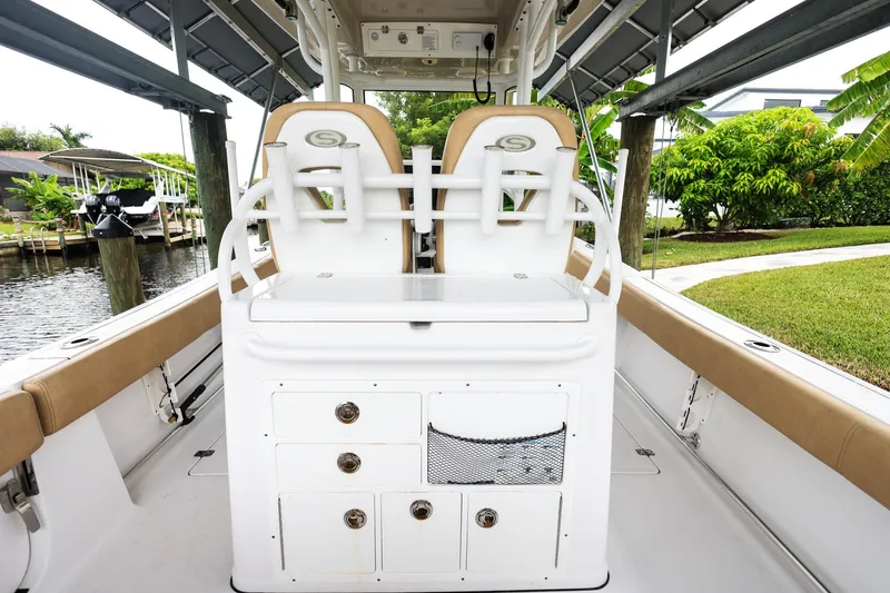 Slide: The Image of 2018 Sportsman Open 282 Center Console boat interior with seating and storage compartments. - 6