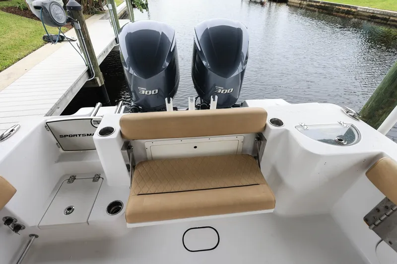 Slide: The Image of 2018 Sportsman Open 282 Center Console with twin Yamaha 300 engines, docked by the water. - 4