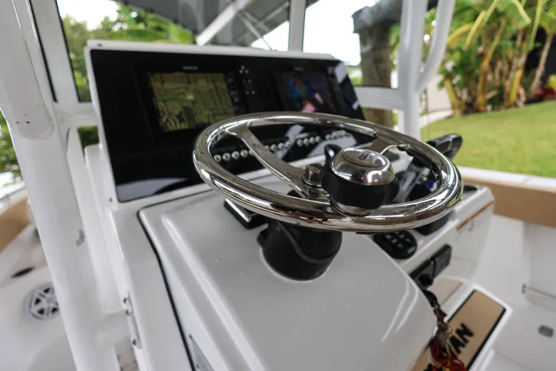 Slide: The Image of Steering wheel of 2018 Sportsman Open 282 Center Console boat with navigation display. - 9