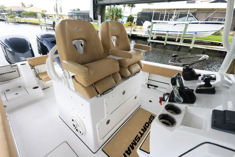 Slide: The Image of 2018 Sportsman Open 282 Center Console boat interior with dual seats and steering controls. - 20