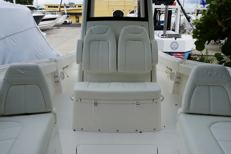 Slide: The Image of 2027 Regulator 25 boat interior with white seating and modern design. - 17