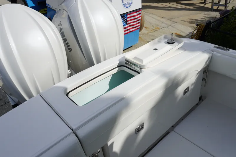 Slide: The Image of 2027 Regulator 25 boat with Yamaha engines and sleek white seating. - 5