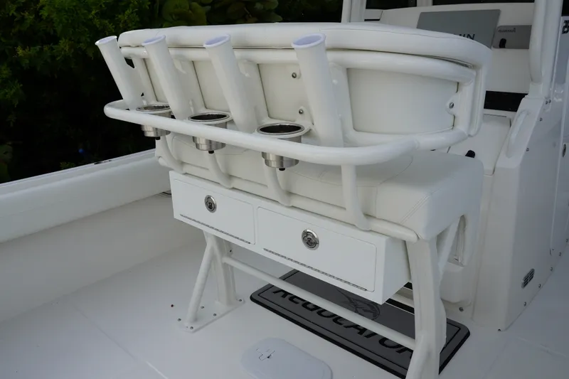 Slide: The Image of 2027 Regulator 25 boat interior with rod holders and storage drawers. - 9