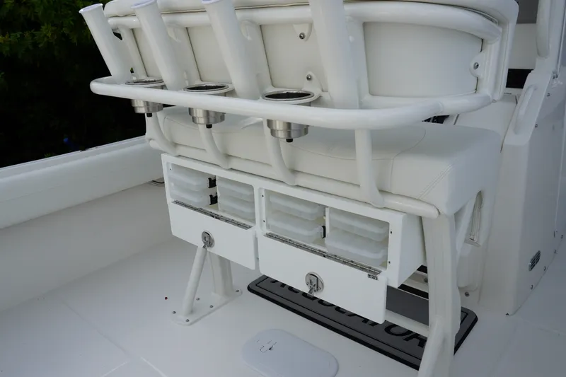 Slide: The Image of 2027 Regulator 25 boat seating with rod holders and storage compartments. - 10