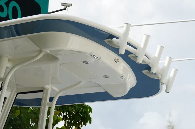 Slide: The Image of 2027 Regulator 25 boat roof with rod holders and sleek design. - 11