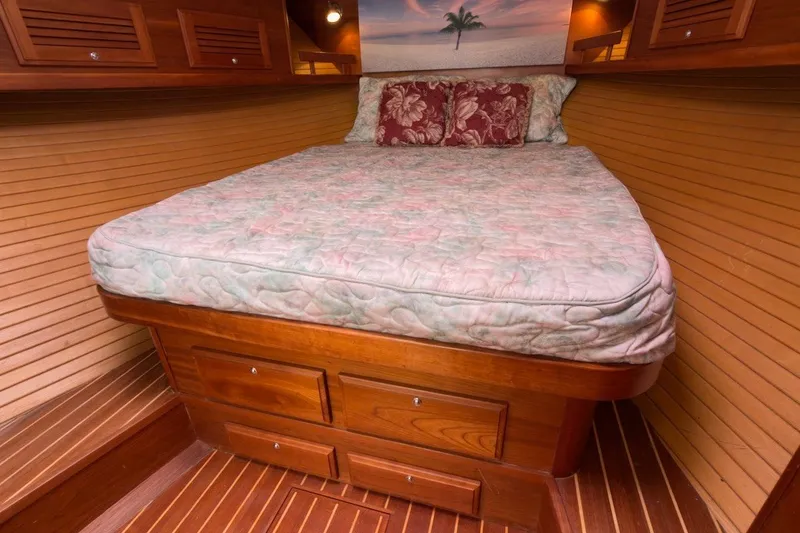Slide: The Image of Cozy cabin interior of 2007 Sabre 34 Express with wooden paneling and comfortable bedding. - 19