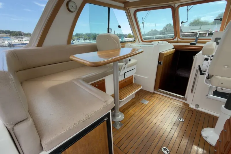 Slide: The Image of Interior of 2007 Sabre 34 Express yacht with wooden flooring and seating area. - 11