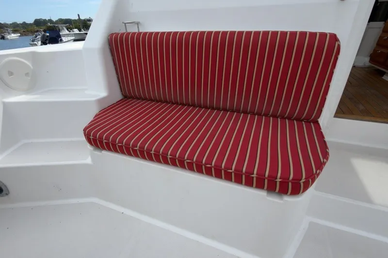 Slide: The Image of Red striped bench seat on 2007 Sabre 34 Express boat deck. - 31