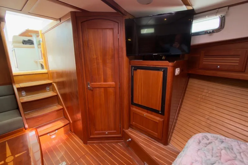 Slide: The Image of Interior of 2007 Sabre 34 Express yacht with wooden cabinetry and mounted TV. - 20