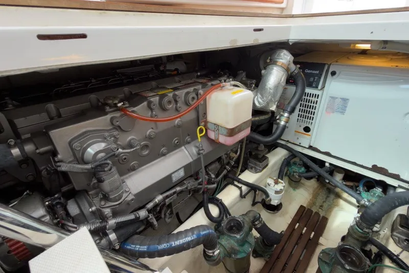 Slide: The Image of Engine compartment of a 2007 Sabre 34 Express boat, showcasing mechanical components and wiring. - 37