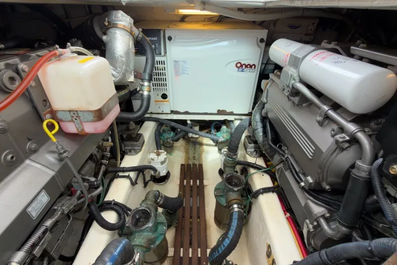 Slide: The Image of Engine room of 2007 Sabre 34 Express with Onan generator and mechanical components. - 38