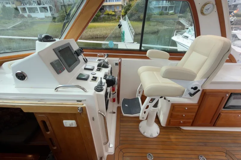 Slide: The Image of Interior helm of 2007 Sabre 34 Express yacht with navigation controls and captain's chair. - 6