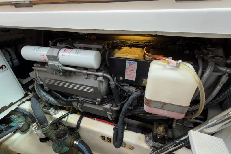 Slide: The Image of Engine compartment of a 2007 Sabre 34 Express boat, showcasing mechanical components. - 36