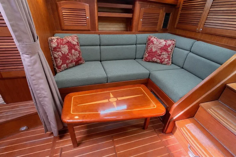 Slide: The Image of Luxurious interior of 2007 Sabre 34 Express yacht with cozy seating and elegant wood finish. - 17