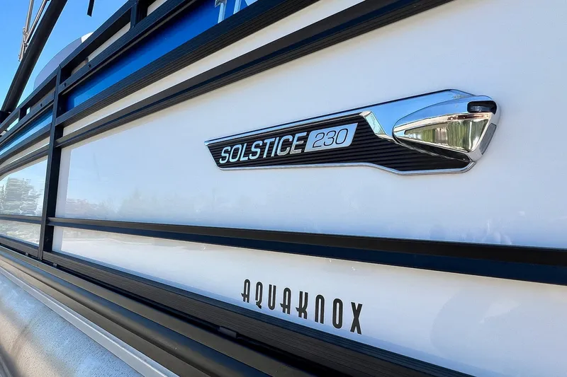 Slide: The Image of 2025 Harris Solstice 230 boat emblem and branding detail. - 21