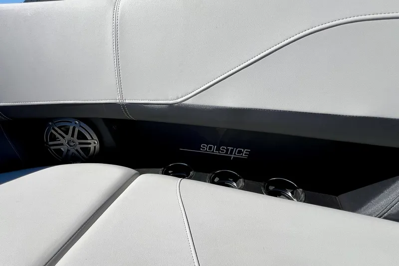 Slide: The Image of Interior of 2025 Harris Solstice 230 boat with speaker and cup holders. - 25
