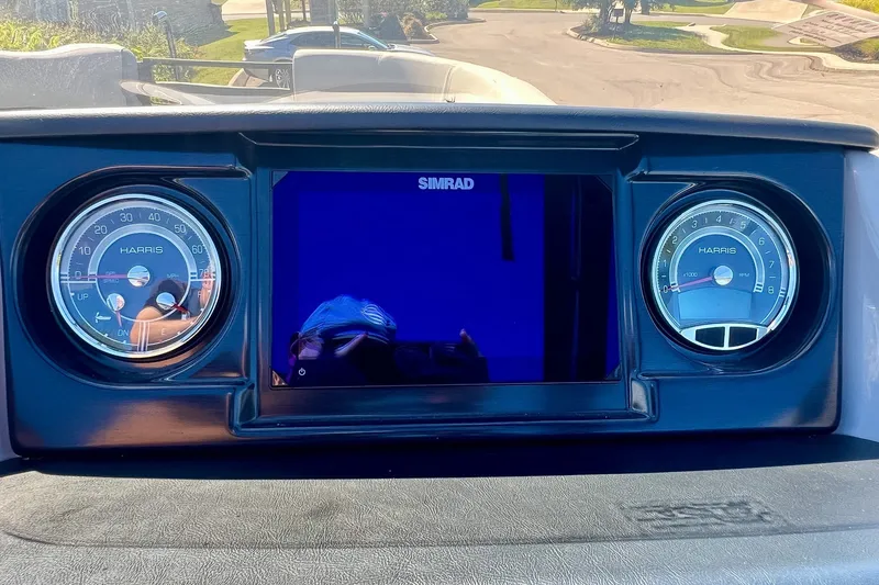 Slide: The Image of Dashboard of 2025 Harris Solstice 230 with Simrad display and gauges. - 37
