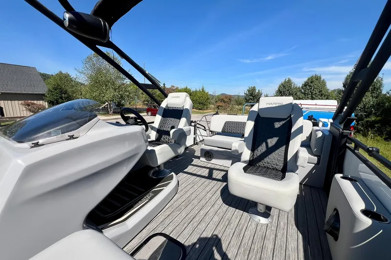 Slide: The Image of 2025 Harris Solstice 230 pontoon boat interior with modern seating and sleek design. - 31