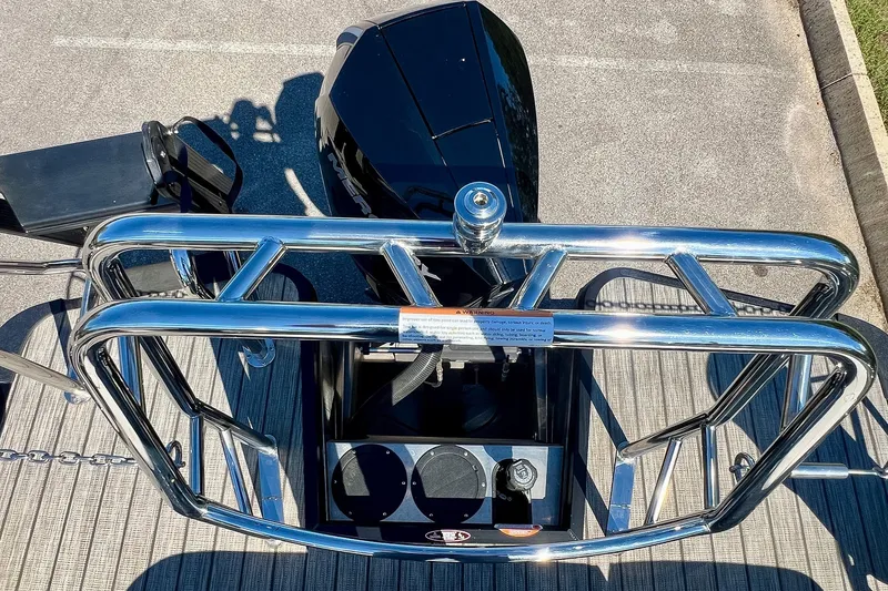 Slide: The Image of 2025 Harris Solstice 230 boat with sleek chrome railing and modern controls. - 57