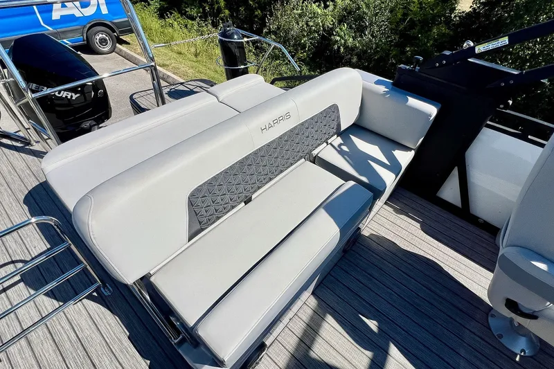 Slide: The Image of 2025 Harris Solstice 230 boat interior with gray seating and modern design. - 45