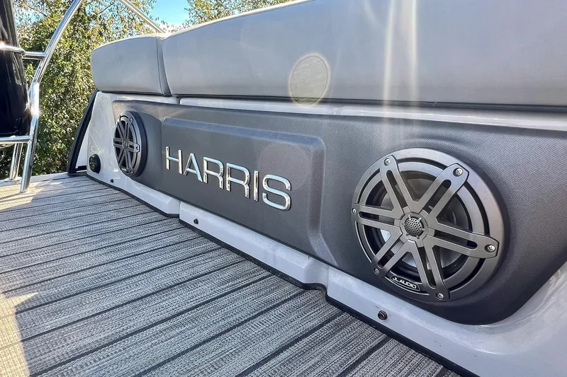 Slide: The Image of 2025 Harris Solstice 230 boat interior with speakers and cushioned seating. - 51
