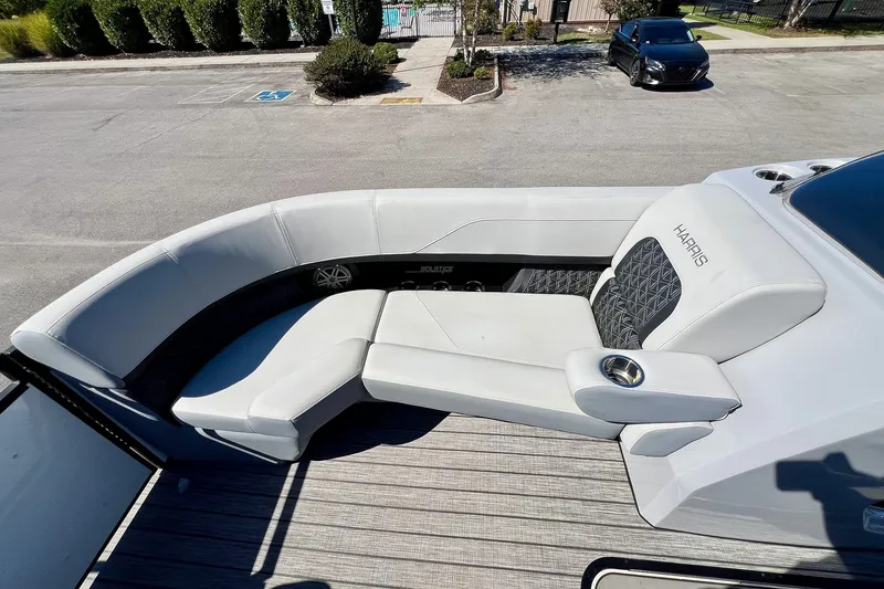 Slide: The Image of 2025 Harris Solstice 230 boat with luxurious white seating and modern design. - 24