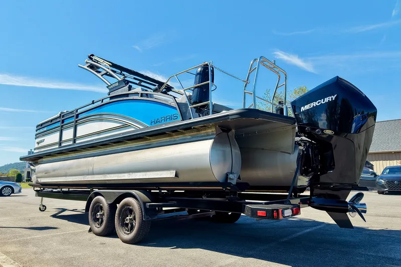 Slide: The Image of 2025 Harris Solstice 230 pontoon boat on trailer with Mercury outboard motor. - 64