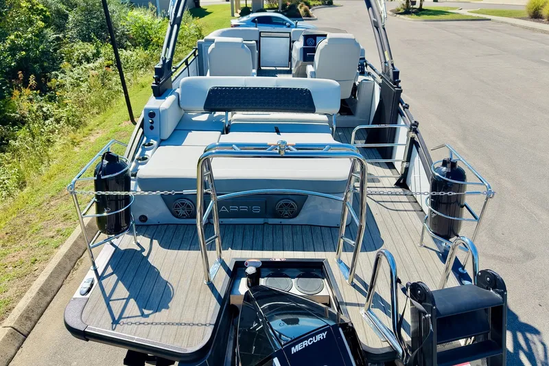 Slide: The Image of 2025 Harris Solstice 230 pontoon boat with spacious deck and modern seating. - 54