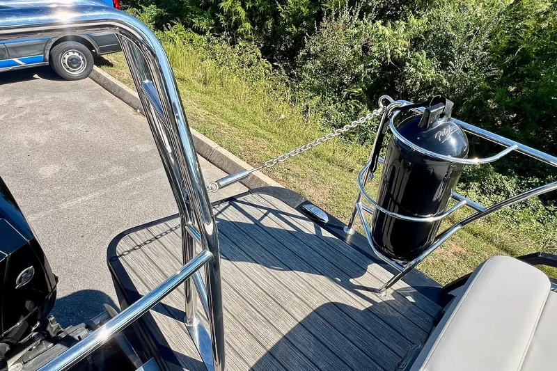 Slide: The Image of 2025 Harris Solstice 230 boat deck with stainless steel railing and propane tank. - 56