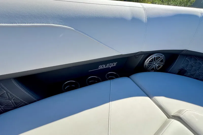 Slide: The Image of 2025 Harris Solstice 230 boat interior with luxurious seating and speaker system. - 28