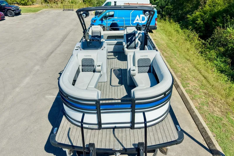 Slide: The Image of 2025 Harris Solstice 230 pontoon boat with spacious seating and modern design. - 6