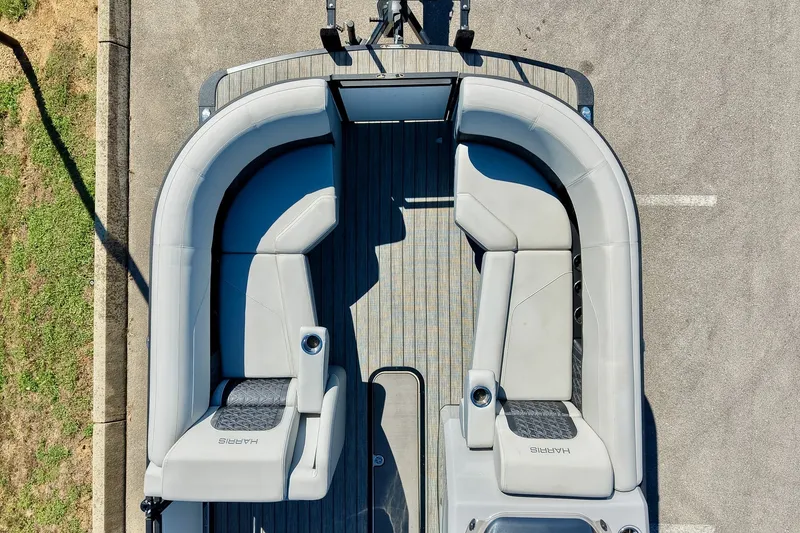 Slide: The Image of Aerial view of 2025 Harris Solstice 230 boat interior with gray seating. - 23