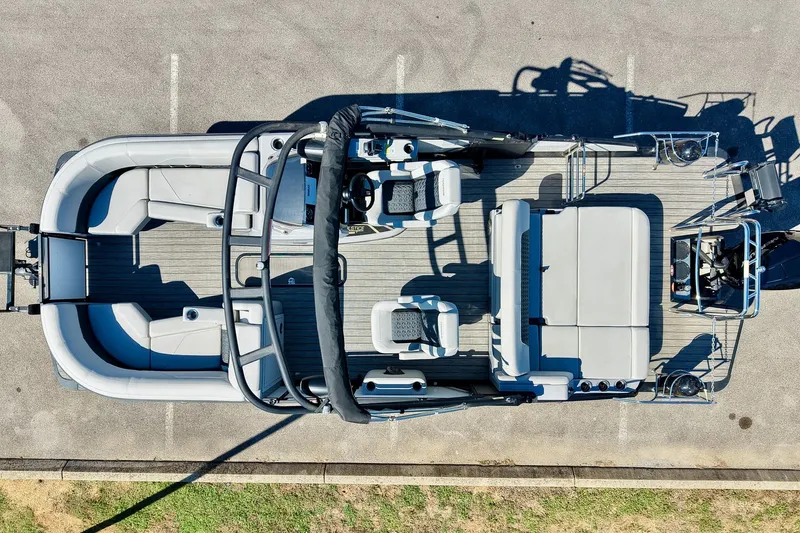 Slide: The Image of Aerial view of 2025 Harris Solstice 230 pontoon boat with spacious seating and modern design. - 4