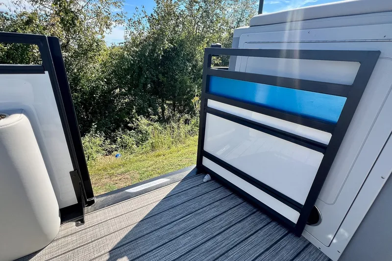 Slide: The Image of 2025 Harris Solstice 230 boat deck with modern railing and scenic outdoor view. - 43