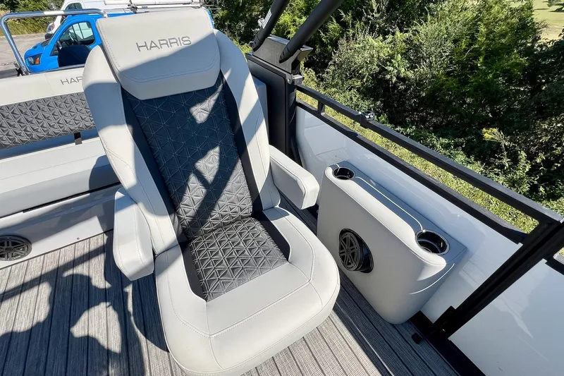 Slide: The Image of Luxurious seating on 2025 Harris Solstice 230 boat, featuring sleek design and cup holders. - 41