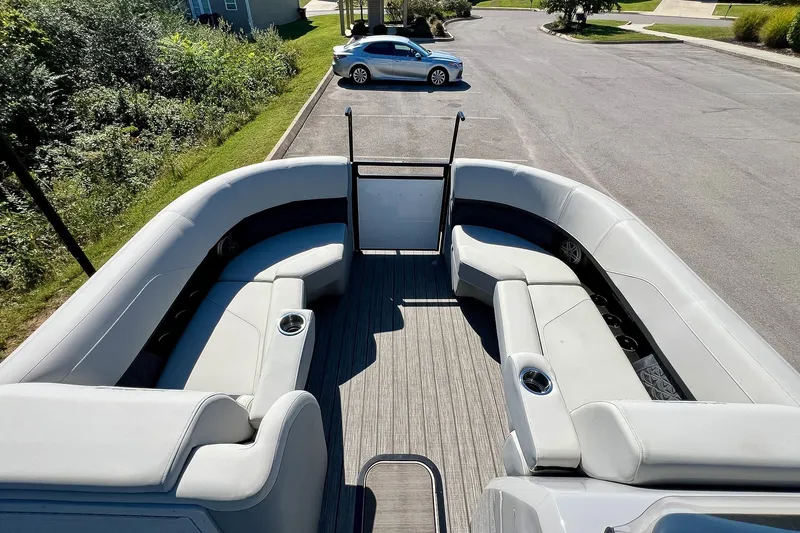 Slide: The Image of 2025 Harris Solstice 230 pontoon boat with spacious seating and modern design. - 30